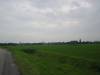 Nieuwerkerk - Panorama van Nieuwerkerk, met links naar rechts gezien:de molen, de torenspits van de Gereformeerde Gemeente, de zendmast aan de Weele en de N.H.Johanneskerk. 31 aug.2006